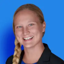 A woman with long blonde hair and a black shirt.