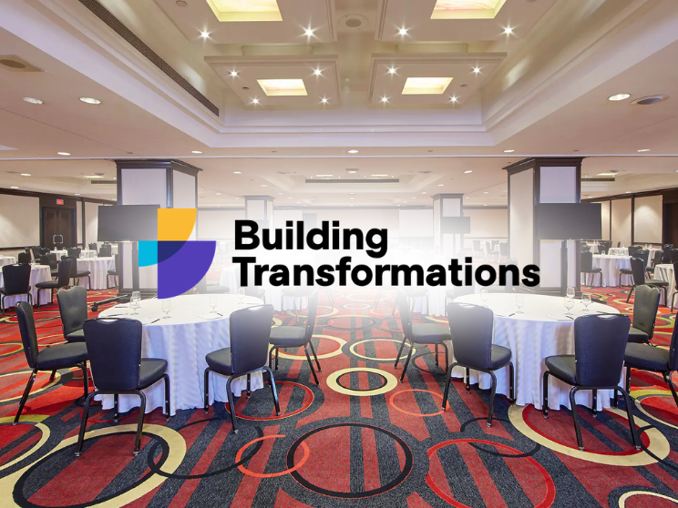 Conference room with "Building Transformations" logo.