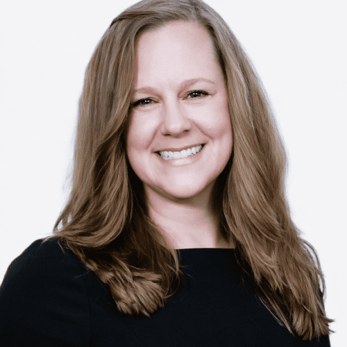 Smiling woman with long brown hair.