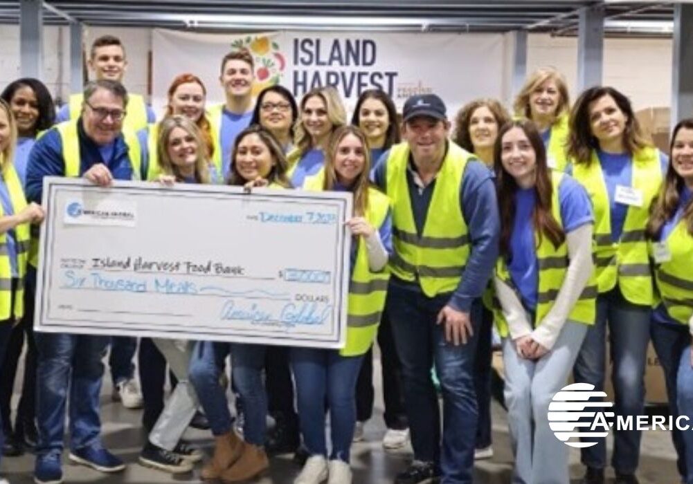 Group of people holding a donation check.